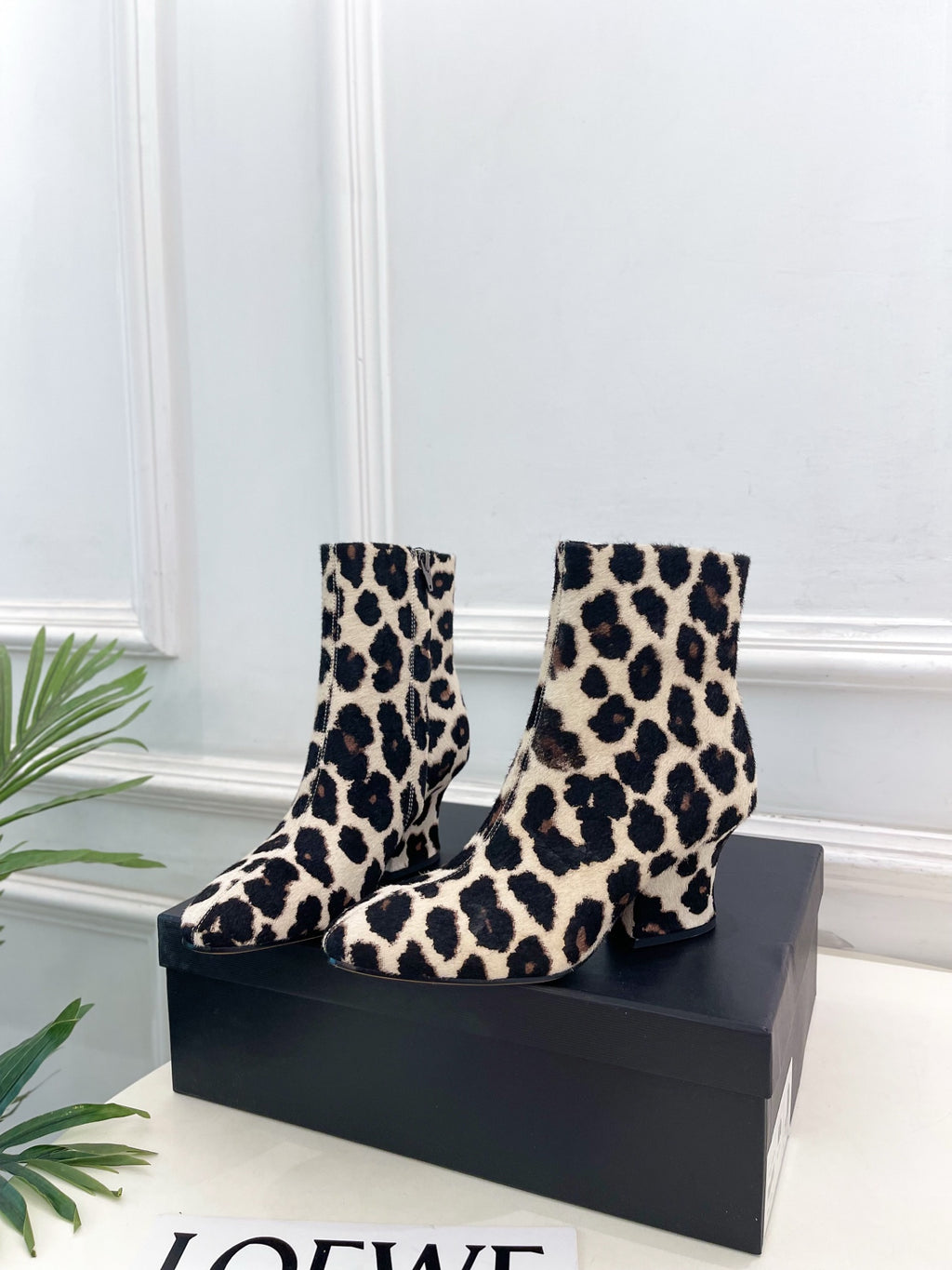 Jil Sander minimalist retro leopard-print ankle boots with round toes and block heels.