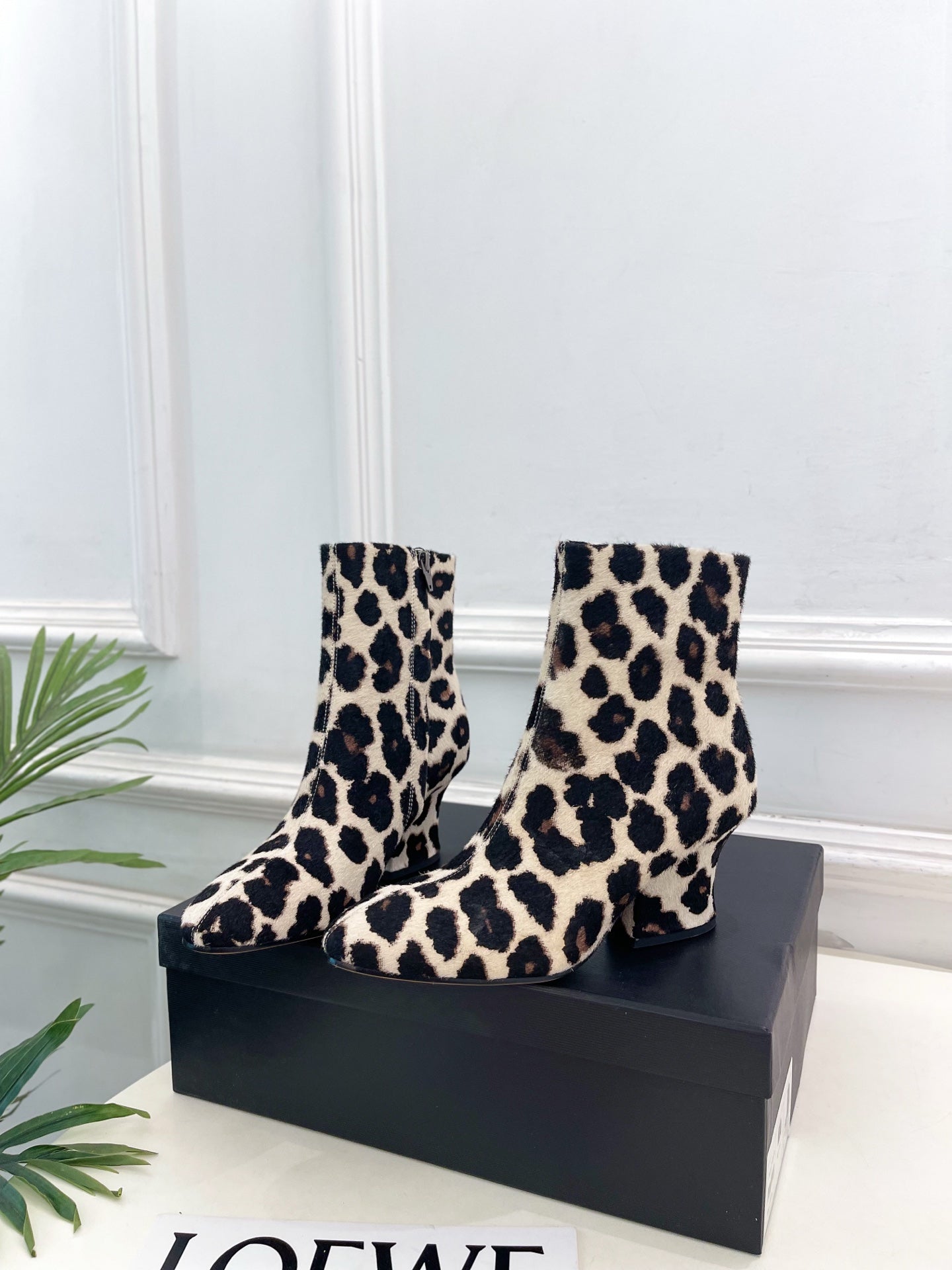 Jil Sander minimalist retro leopard-print ankle boots with round toes and block heels.