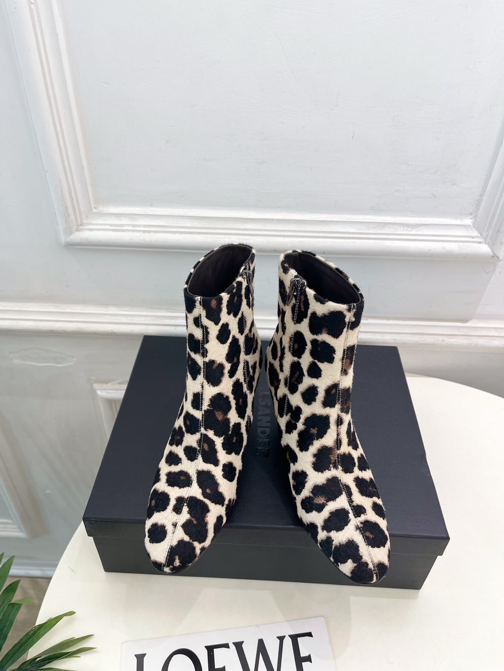 Jil Sander minimalist retro leopard-print ankle boots with round toes and block heels.