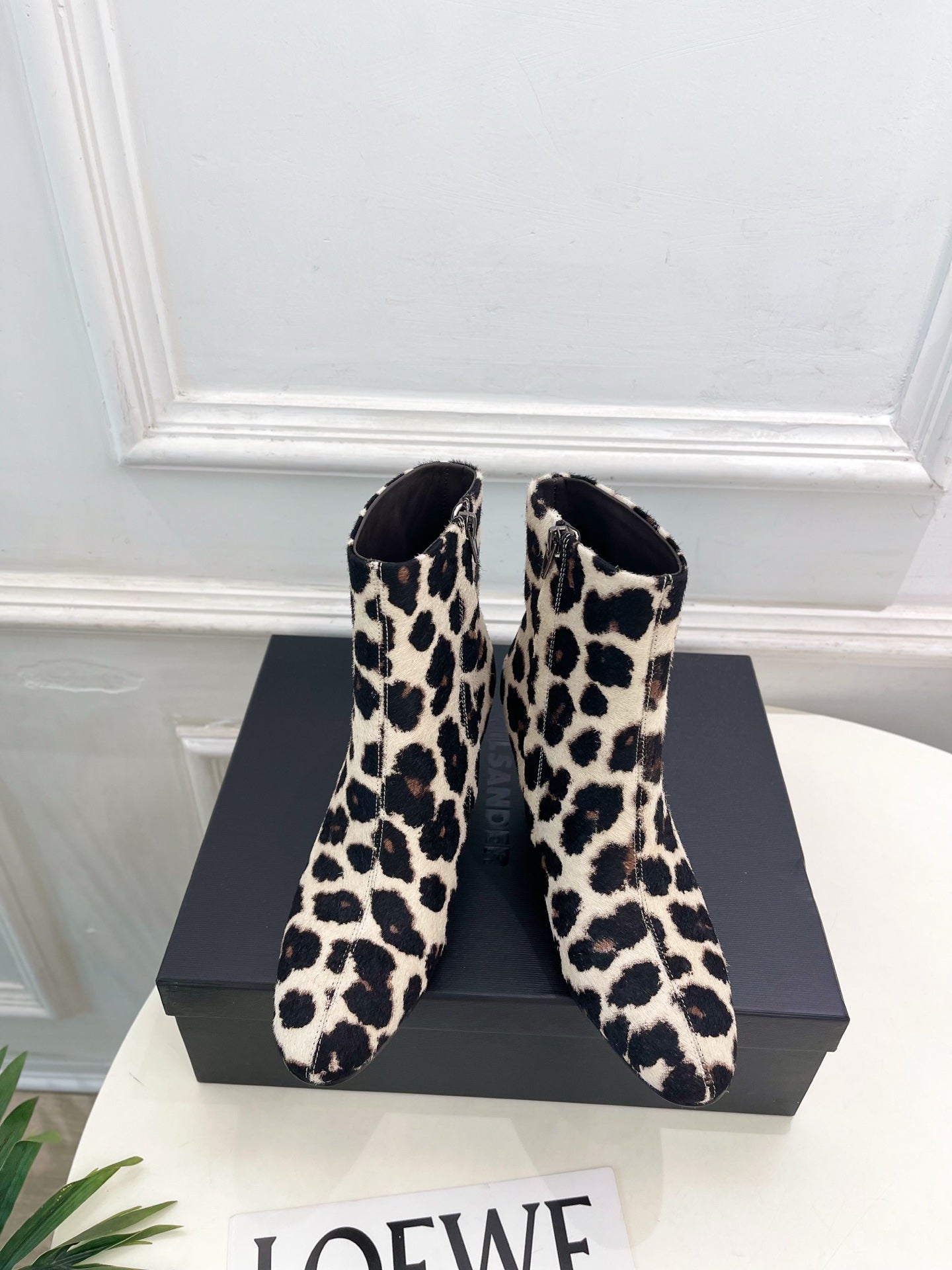 Jil Sander minimalist retro leopard-print ankle boots with round toes and block heels.