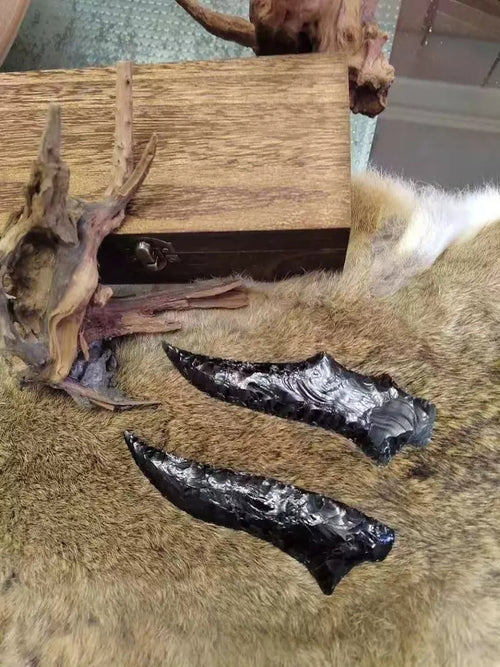 Chipped stone tool, stone knife, stone blade, obsidian knife, fine obsidian knife, hunting knife, primitive hunting knife.