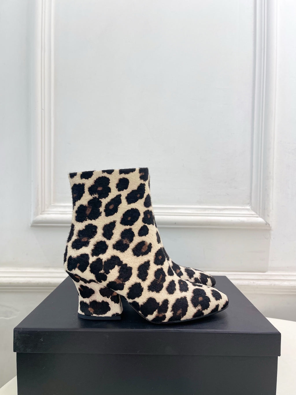 Jil Sander minimalist retro leopard-print ankle boots with round toes and block heels.
