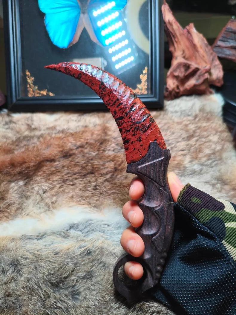 Flaked stone blade (CS:GO Karambit style); pressure-flaked obsidian; African blackwood handle.