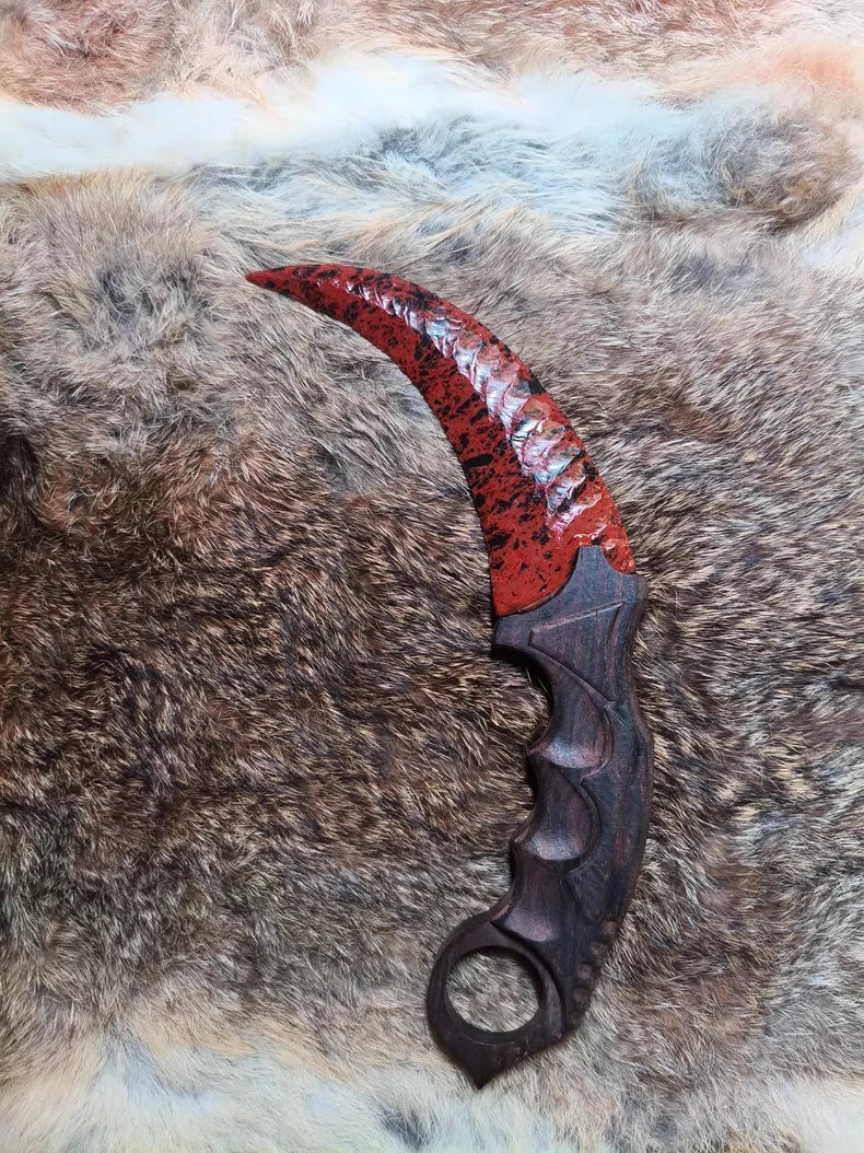 Flaked stone blade (CS:GO Karambit style); pressure-flaked obsidian; African blackwood handle.