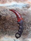 Flaked stone blade (CS:GO Karambit style); pressure-flaked obsidian; African blackwood handle.