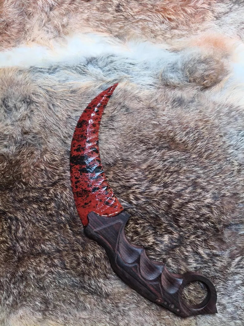 Flaked stone blade (CS:GO Karambit style); pressure-flaked obsidian; African blackwood handle.