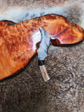 Hand-knapped stone knife for opening packages; uniquely shaped, premium silver sheen obsidian knife.