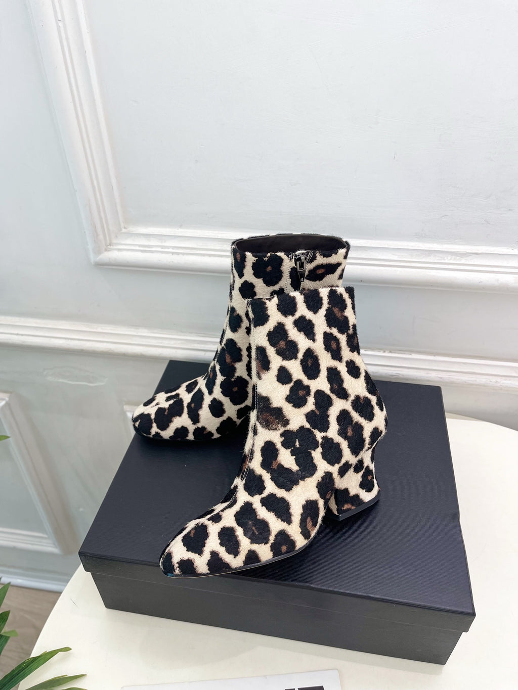 Jil Sander minimalist retro leopard-print ankle boots with round toes and block heels.