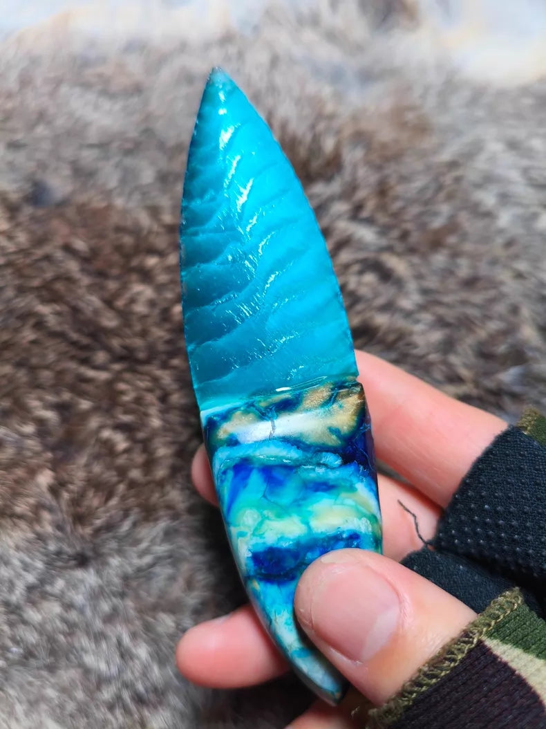 Hand-knapped stone blade with a stabilized mammoth ivory handle and blue cat's-eye stone inlay; a tactile art piece featuring pressure-flaking craftsmanship.