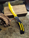 Chipped stone knife; CS:GO butterfly knife style; crafted from golden cat's-eye stone.