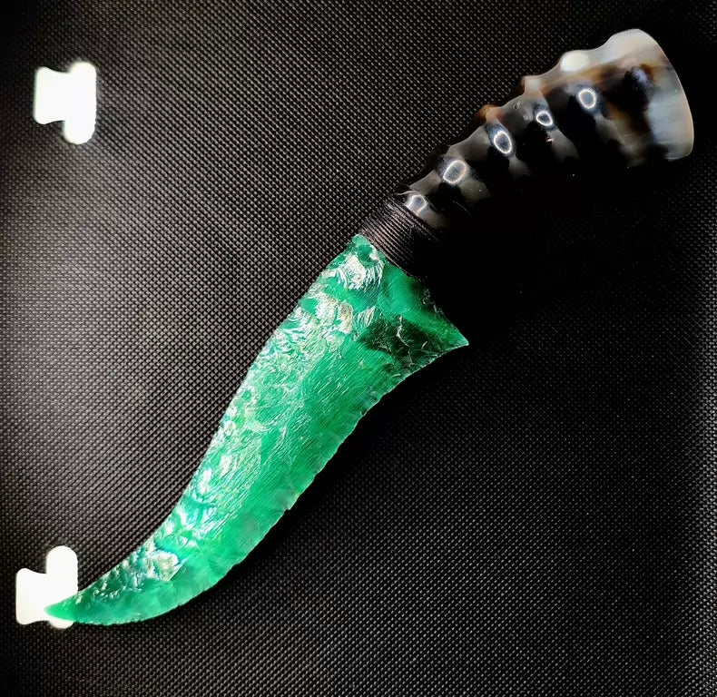 Flaked stone knives; deep green cat's-eye stone knife; flame-shaped stone knife; obsidian knife; obsidian "dragon-glass" blade.