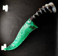 Flaked stone knives; deep green cat's-eye stone knife; flame-shaped stone knife; obsidian knife; obsidian "dragon-glass" blade.
