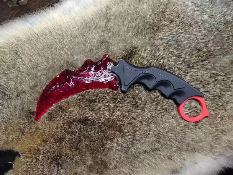 Chipped stone knife; in-stock, uniquely shaped K9 red crystal karambit.