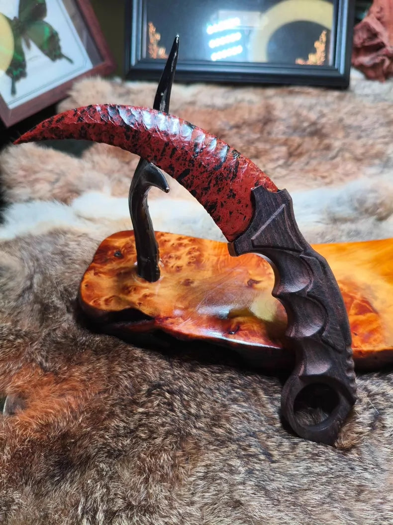 Flaked stone blade (CS:GO Karambit style); pressure-flaked obsidian; African blackwood handle.