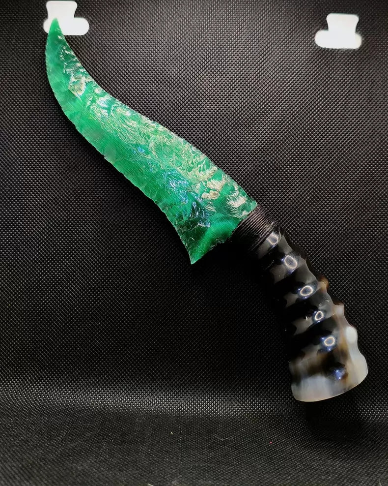 Flaked stone knives; deep green cat's-eye stone knife; flame-shaped stone knife; obsidian knife; obsidian "dragon-glass" blade.