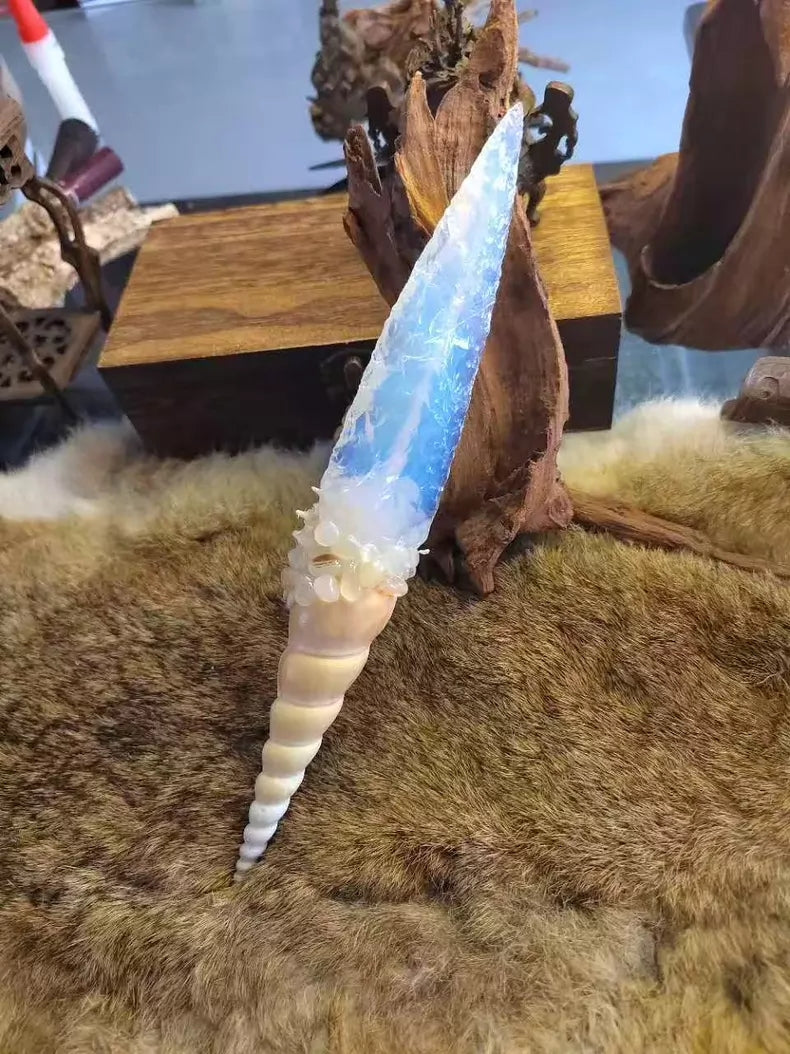 Chipped stone tool; stone knife; stone blade; precious opal conch-shell knife; "Blade of the Ocean"—a divine gift from the Water God; opal knife.