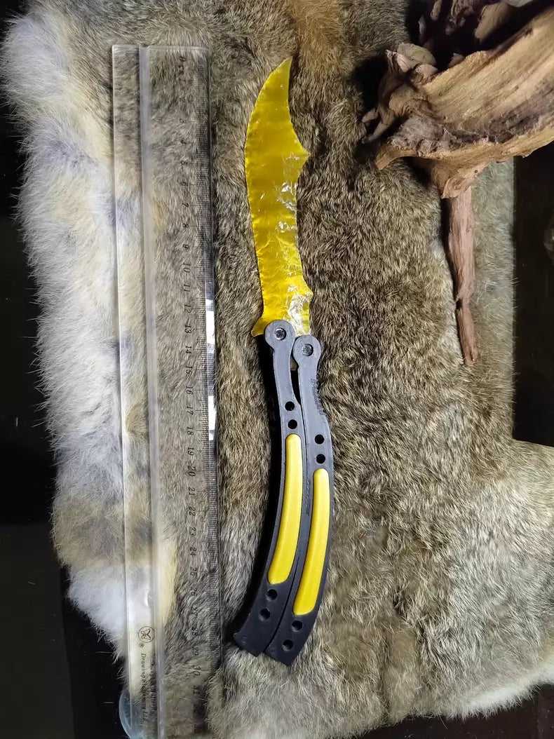 Chipped stone knife; CS:GO butterfly knife style; crafted from golden cat's-eye stone.