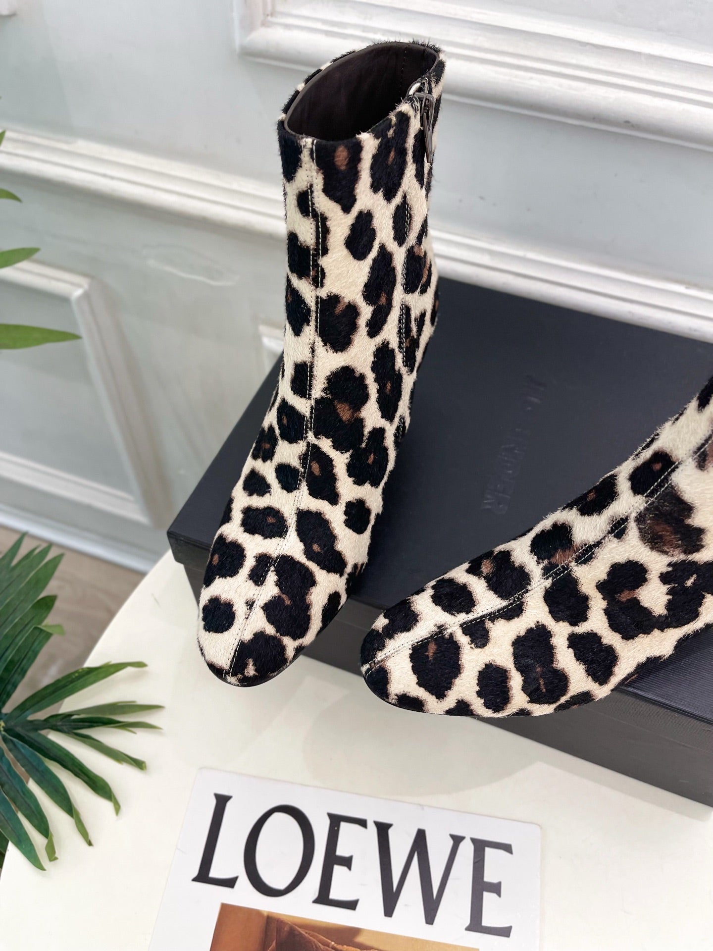 Jil Sander minimalist retro leopard-print ankle boots with round toes and block heels.