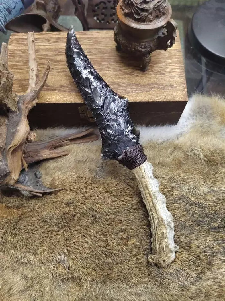 Chipped stone tool, stone knife, stone blade, obsidian knife, fine obsidian knife, hunting knife, primitive hunting knife.