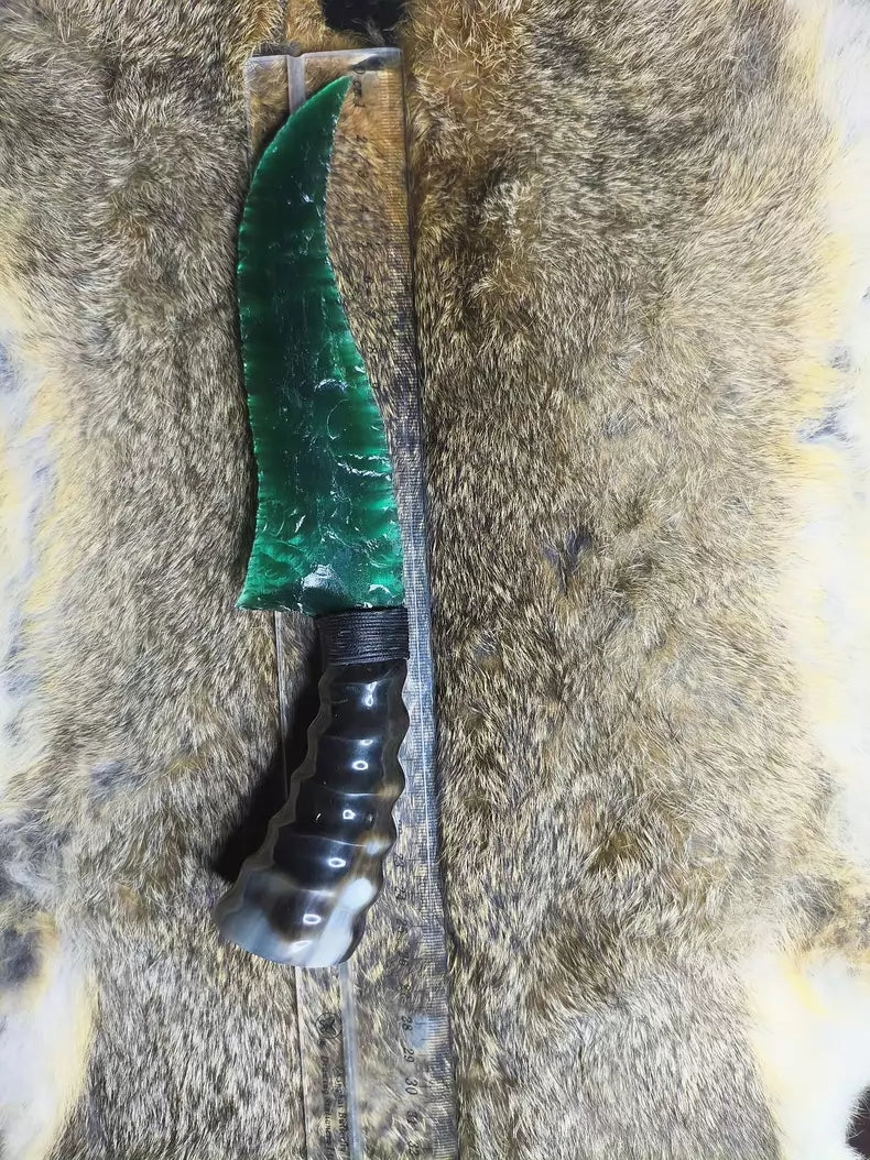 Flaked stone knives; deep green cat's-eye stone knife; flame-shaped stone knife; obsidian knife; obsidian "dragon-glass" blade.