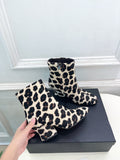 Jil Sander minimalist retro leopard-print ankle boots with round toes and block heels.