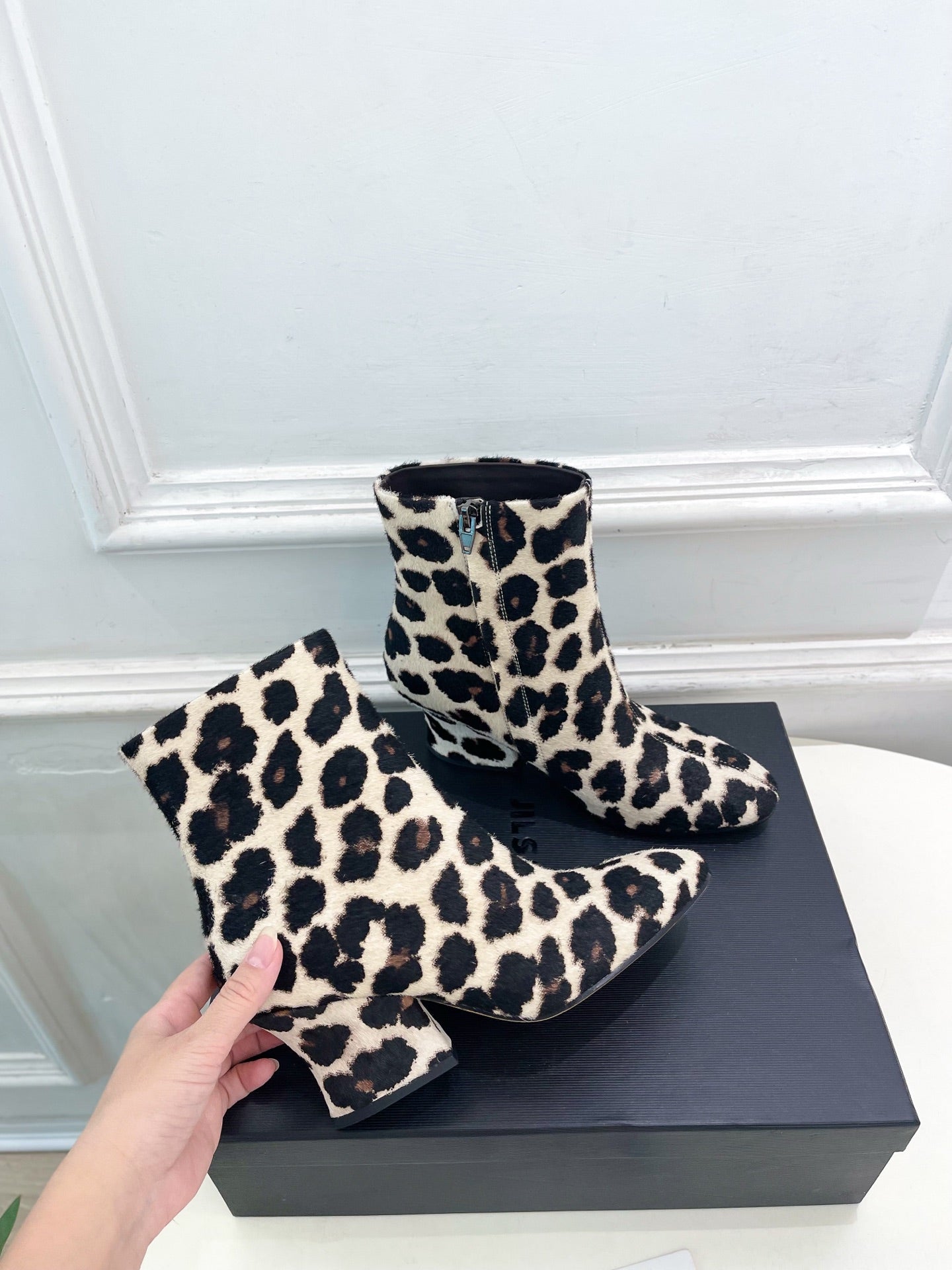 Jil Sander minimalist retro leopard-print ankle boots with round toes and block heels.