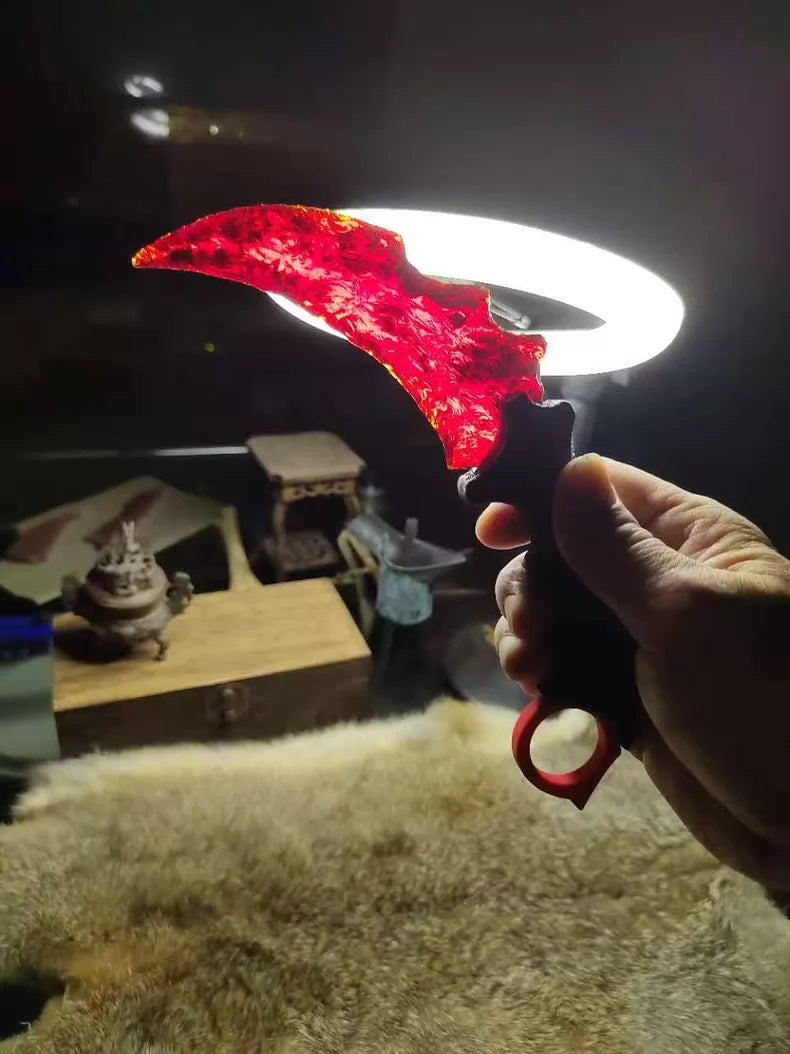 Chipped stone knife; in-stock, uniquely shaped K9 red crystal karambit.
