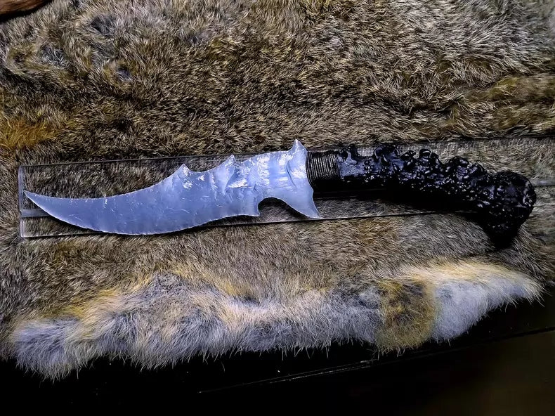 Chipped stone knife, silvery-white cat's-eye, silvery-white gemstone, flame-shaped stone blade, obsidian blade, obsidian "dragon-glass" treasure blade, "Ceremonial White Dragon"