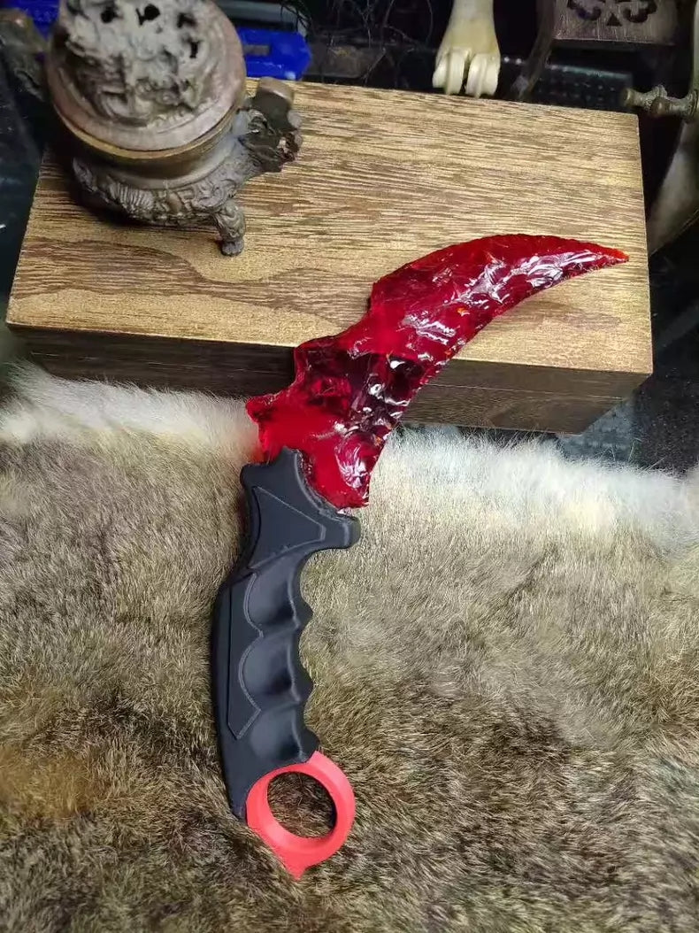 Chipped stone knife; in-stock, uniquely shaped K9 red crystal karambit.