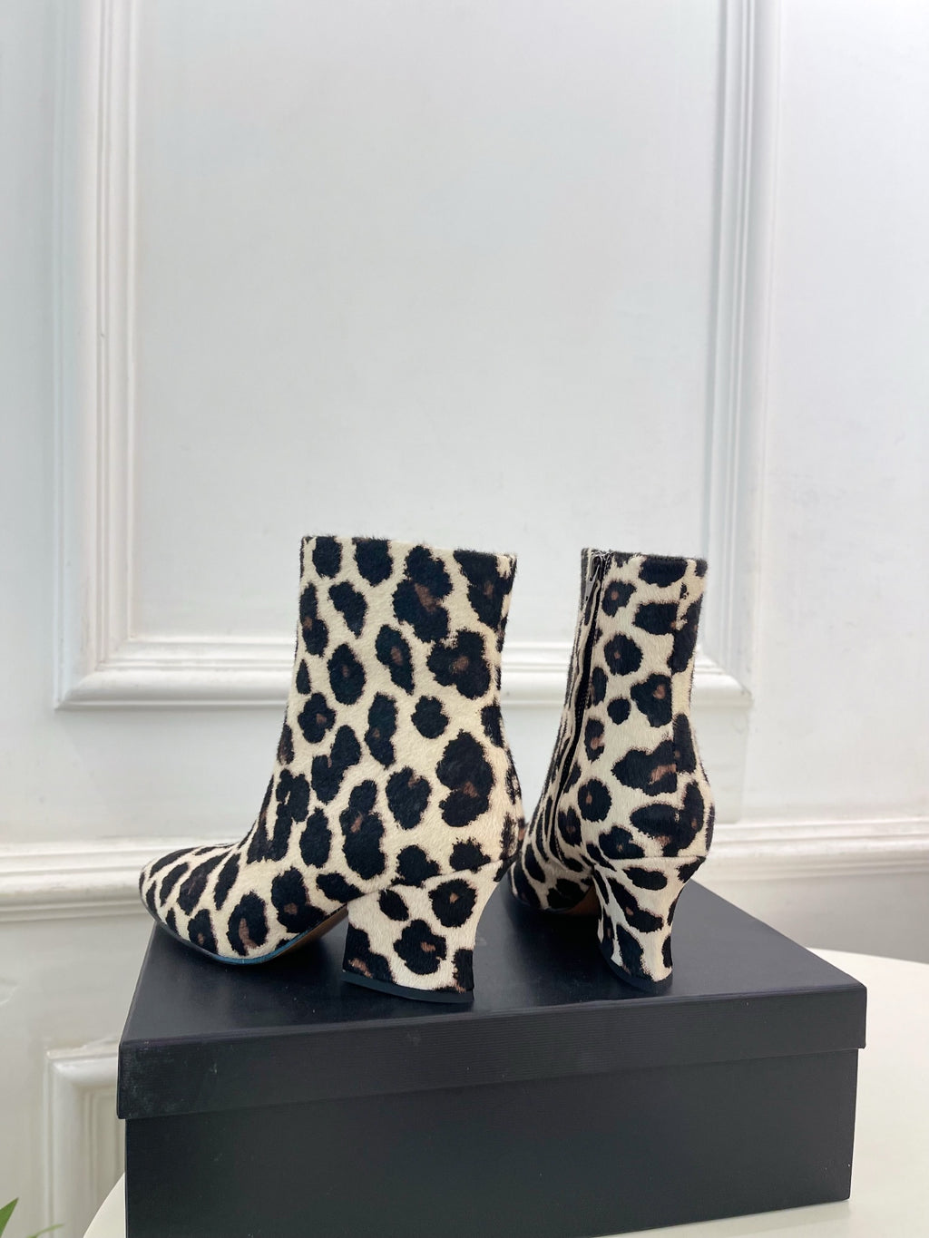 Jil Sander minimalist retro leopard-print ankle boots with round toes and block heels.