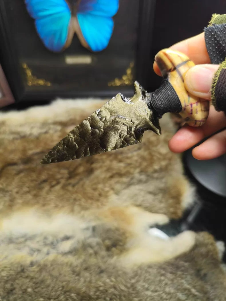 Knapped gold-sheen obsidian knife with a stabilized mammoth tusk handle.