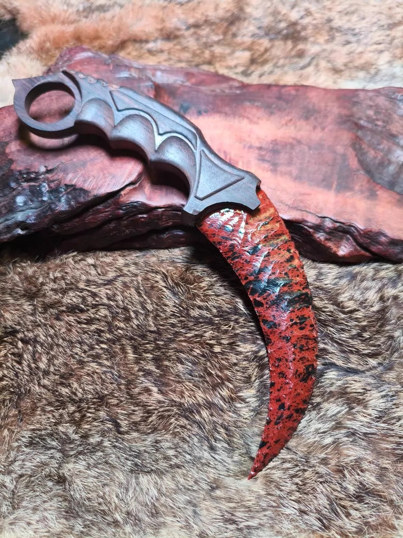 Flaked stone blade (CS:GO Karambit style); pressure-flaked obsidian; African blackwood handle.